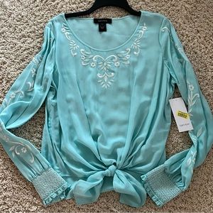 Karen Kane blouse in Aqua color with white embroidery.